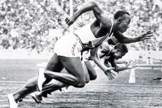 1936 Olympic Games, Berlin, Germany, Men's 100 Metres Final, USA's legendary Jesse Owens on his way to winning one of his four gold medals (Photo by Popperfoto/Getty Images)