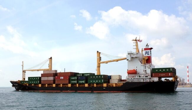 Cargo ship, logistics industry. Free public domain CC0 photo.