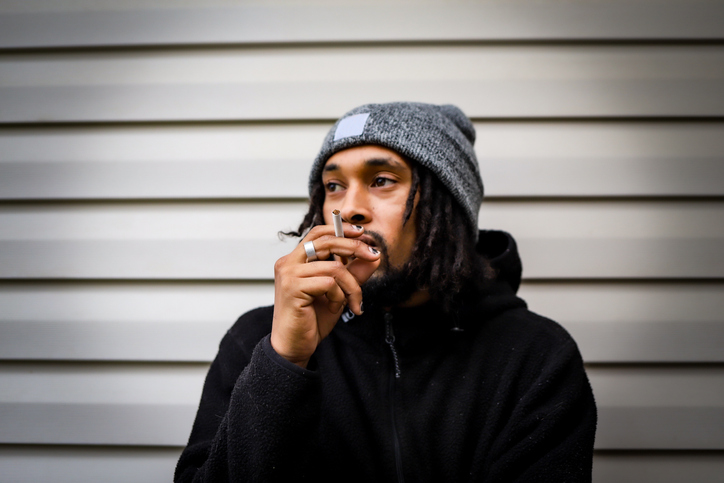 A portrait of a black African-American man looking away and feeling sad