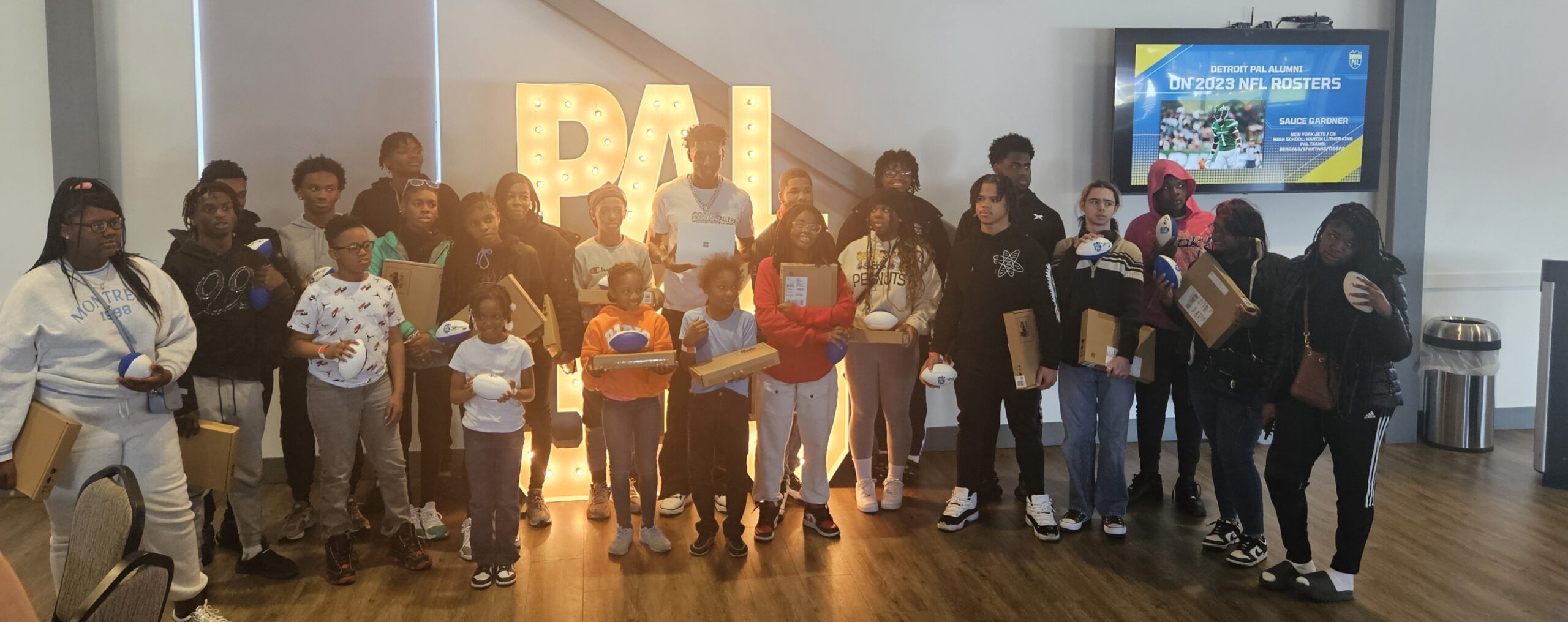 NFL Star Sauce Gardner Gifts 25 Detroit PAL Youth with Microsoft Surface Laptops