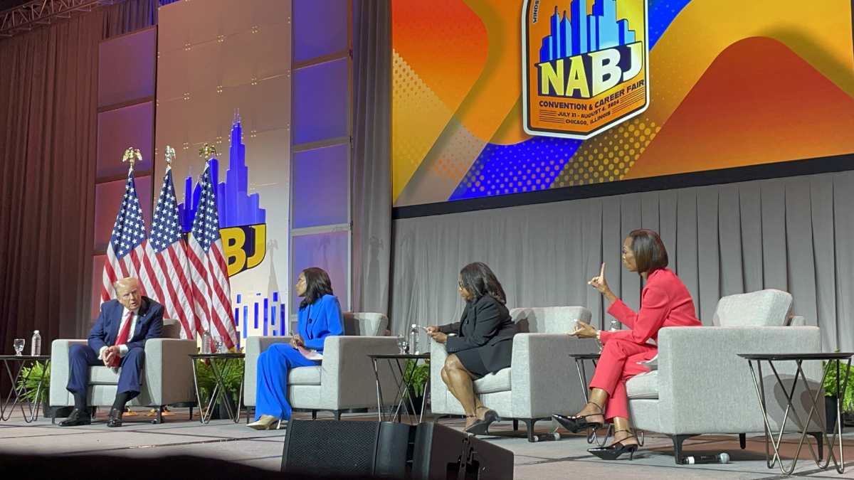 Donald Trump onstage with Rachel Scott of ABC News, Kadia Goba of Semafor and Harris Faulkner of FOX News